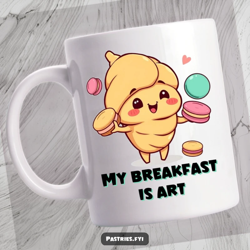 Funny mug showing a happy croissant character with a mischievous grin, expertly juggling colorful macarons with high energy.