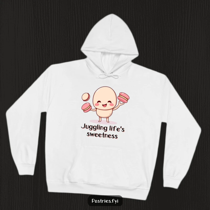 Funny macaron character giggling while juggling smaller macarons, designed on a soft, cozy hoodie for ultimate comfort and whimsy.